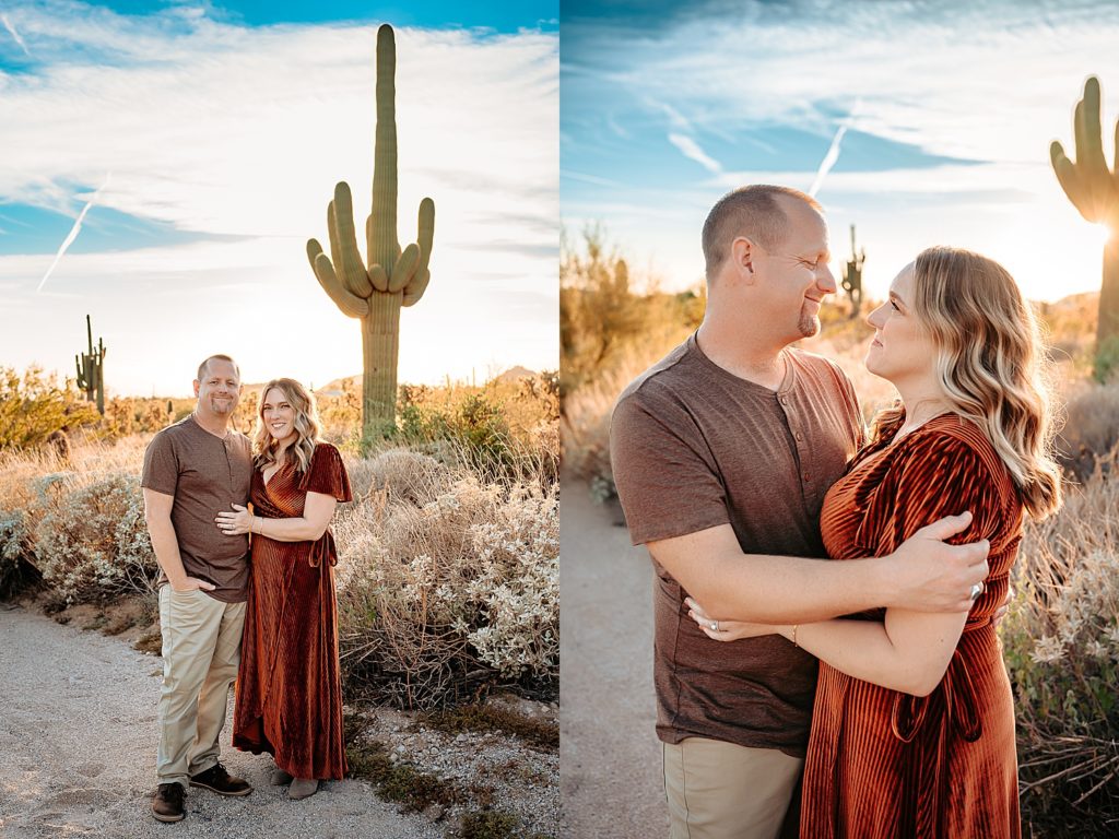 Husband and wife posing in front of Arizona scenery in boho clothing.