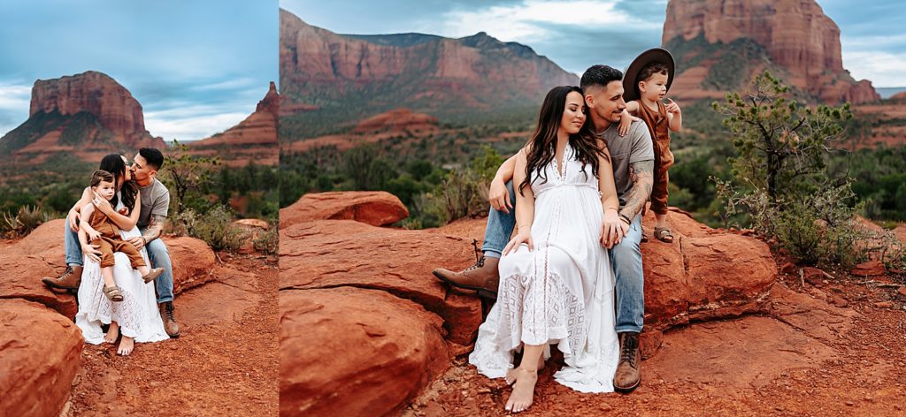 Family of three sitting on a red rock with Arizona background behind them.